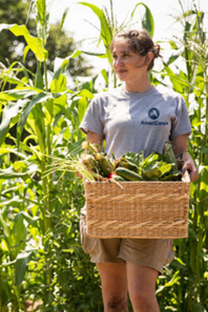 AmeriCorps member serving in a community garden