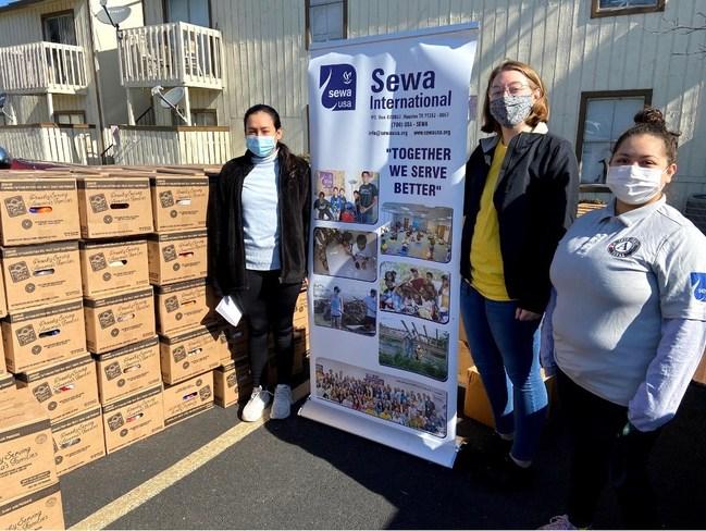 AmeriCorps members serving with Sewa International host a food drive. 