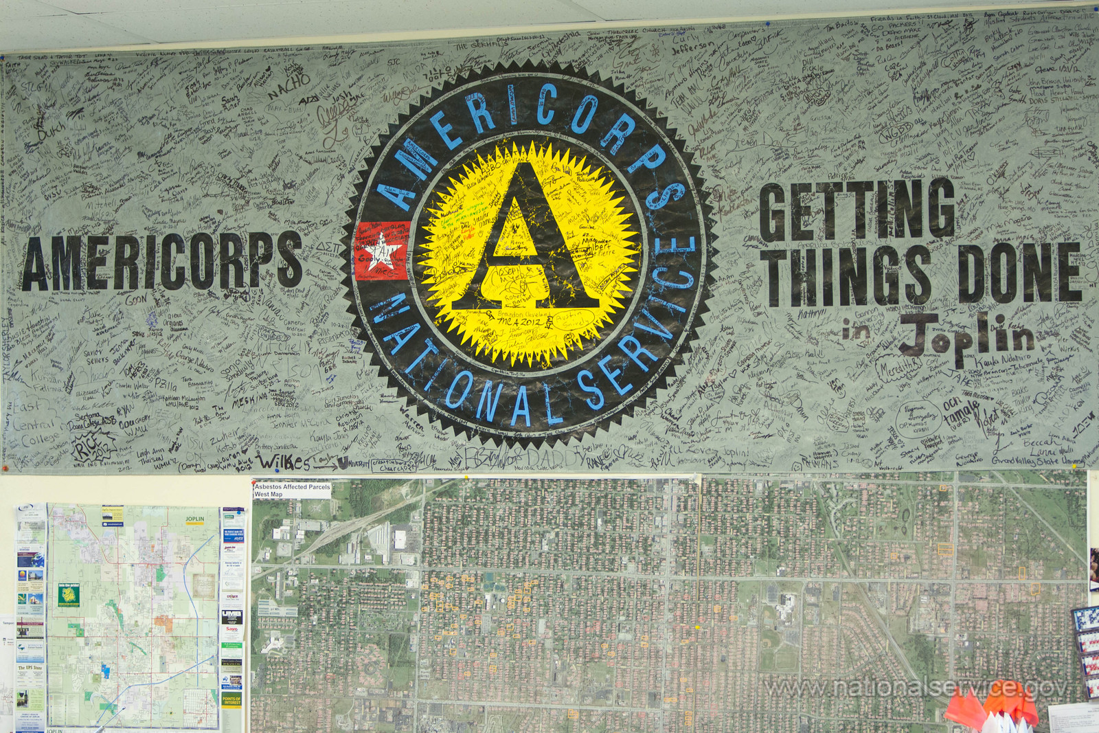 Old AmeriCorps logo on a wall with "Getting Things Done" text adjacent
