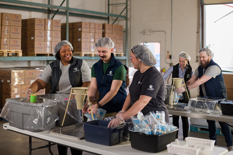 AmeriCorps members serving at a food bank. 