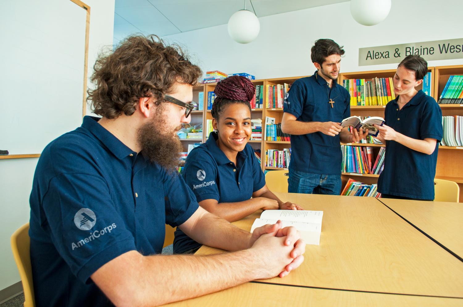 AmeriCorps members in library