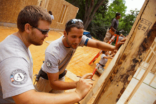 AmeriCorps members building a home