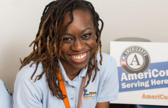 AmeriCorps member smiles while serving with Reading Partners